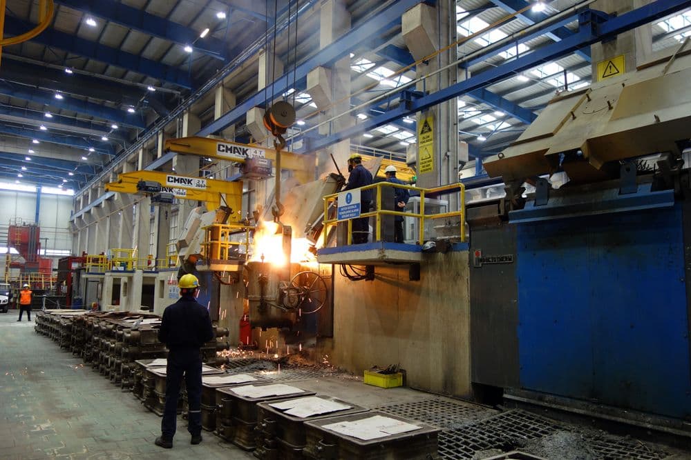 Overhead view of a steel pour at a network foundry